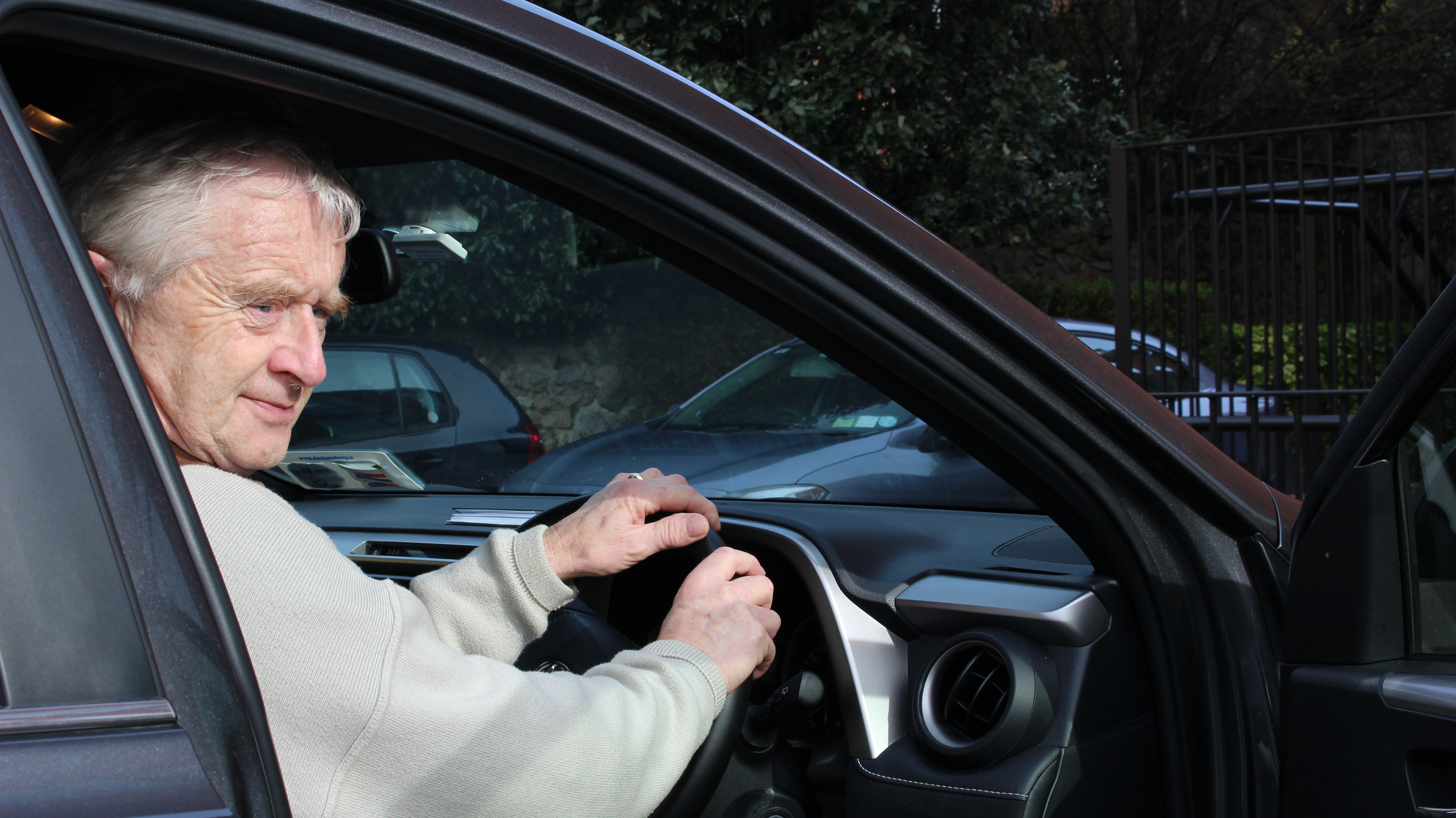 Volunteer driver in his car