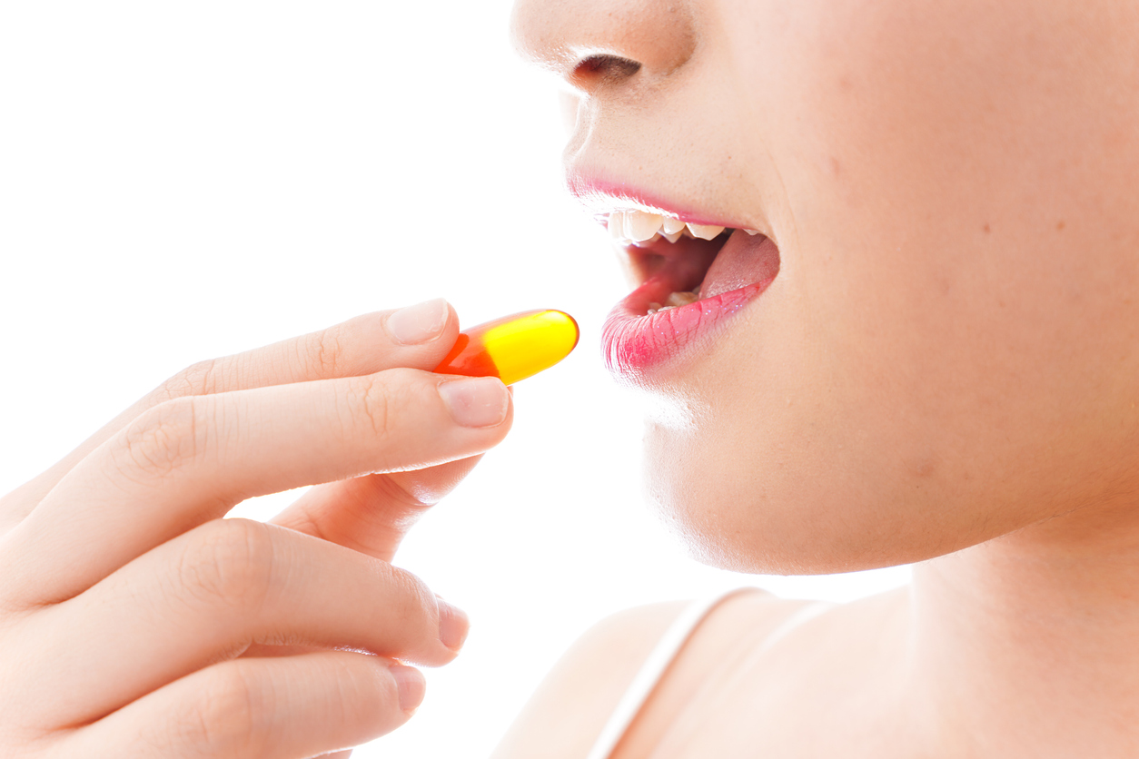 Woman taking a pill