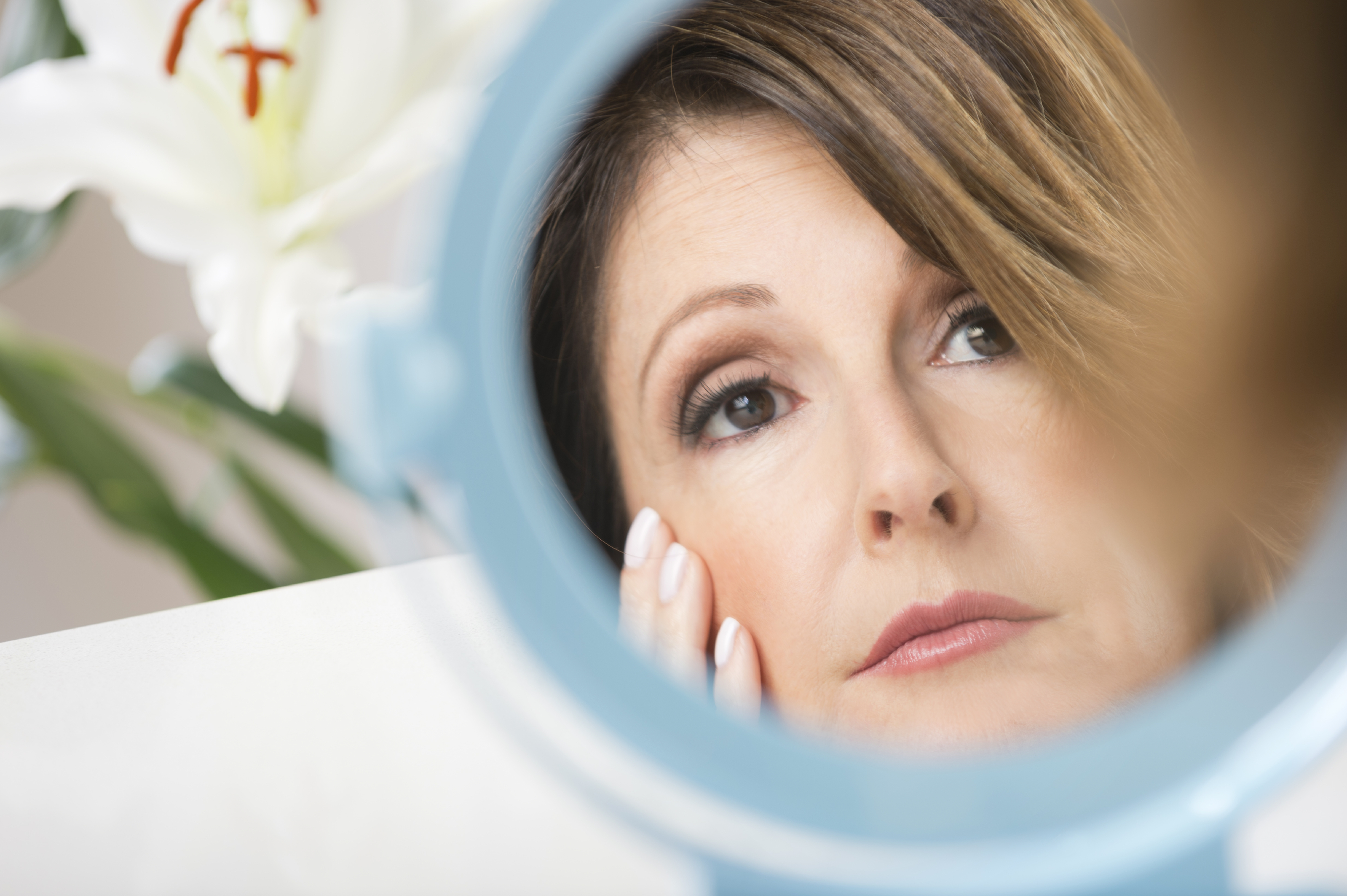 Woman looking in a mirror