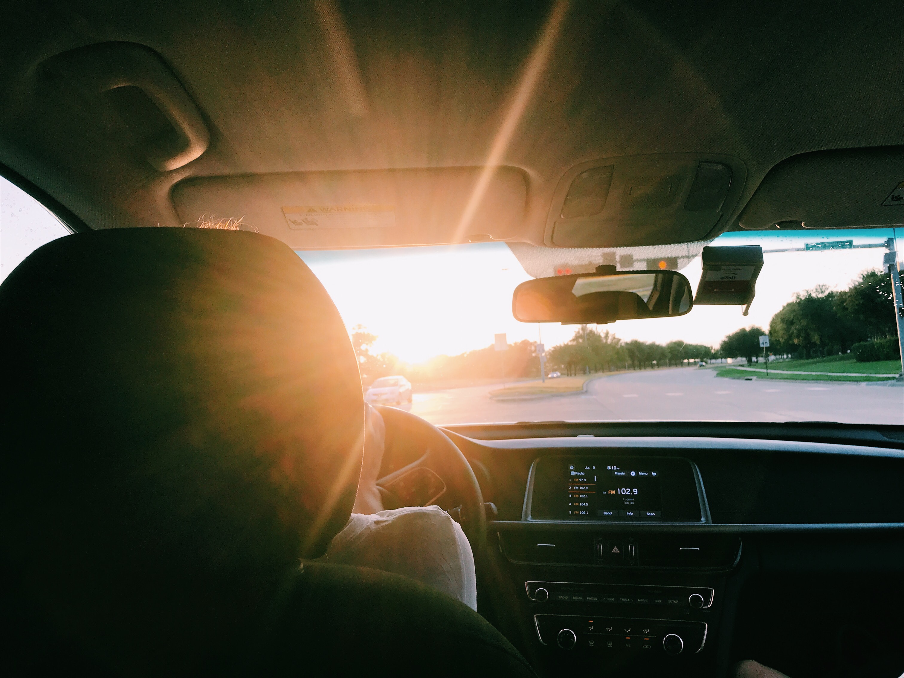 View of a road from the driver's seat of a car