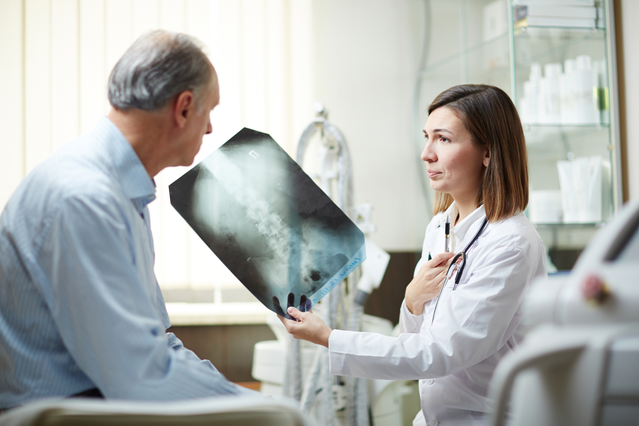 Doctor showing man an x-ray
