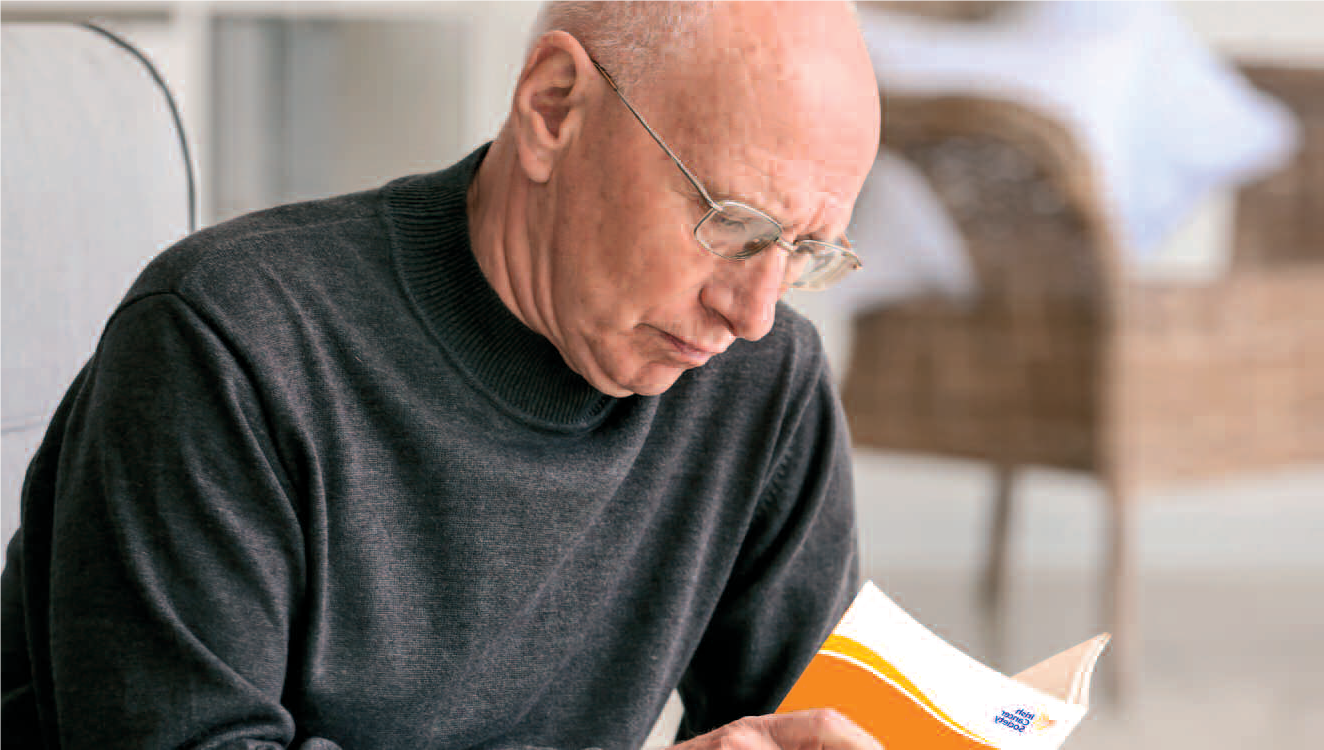 man reading cancer information