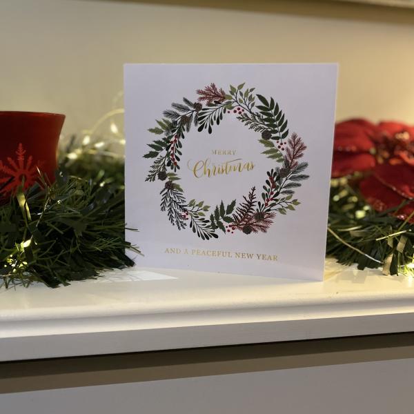 Christmas card on a mantel piece