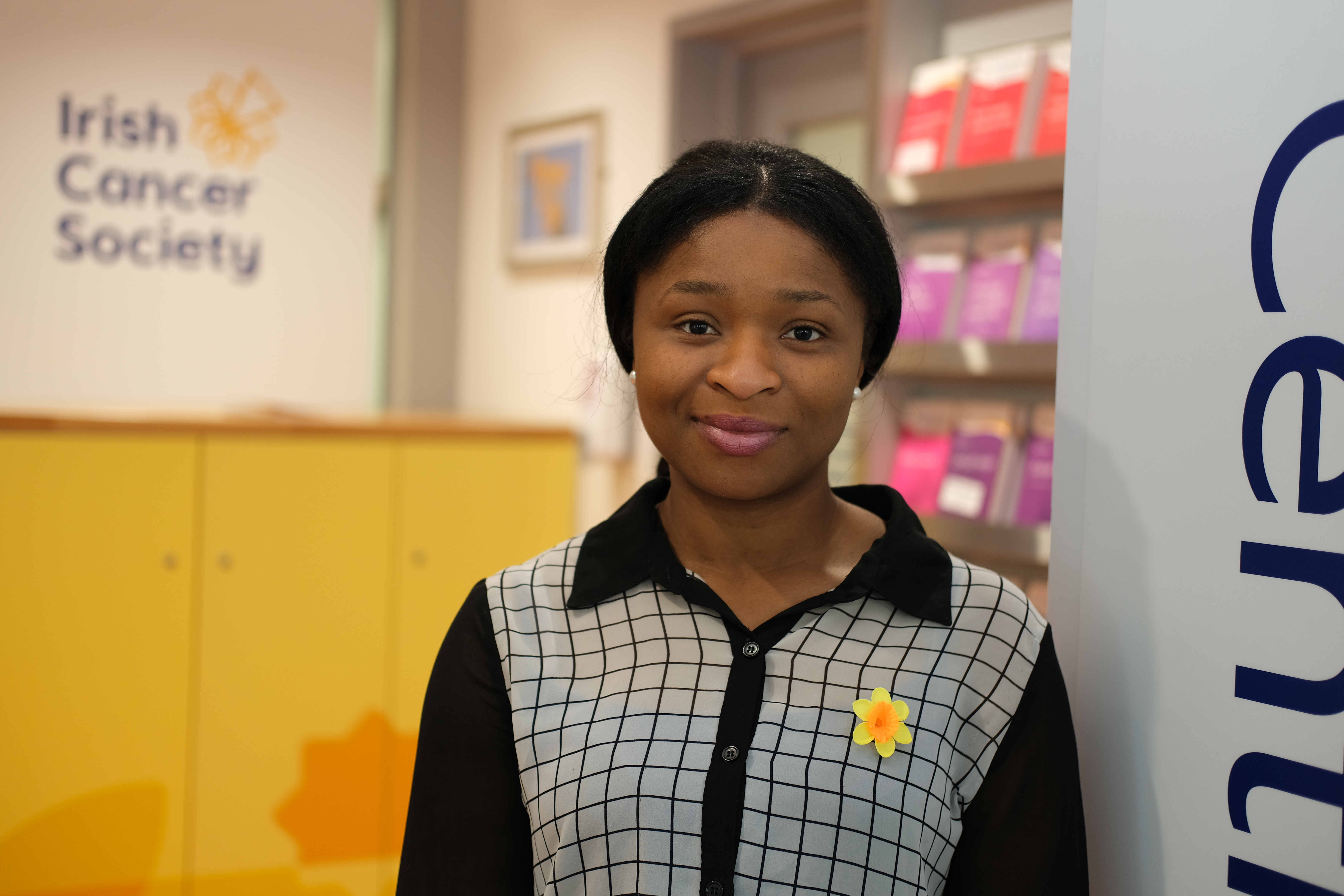 An Irish Cancer Society cancer nurse stands at the entrance to a Daffodil Centre