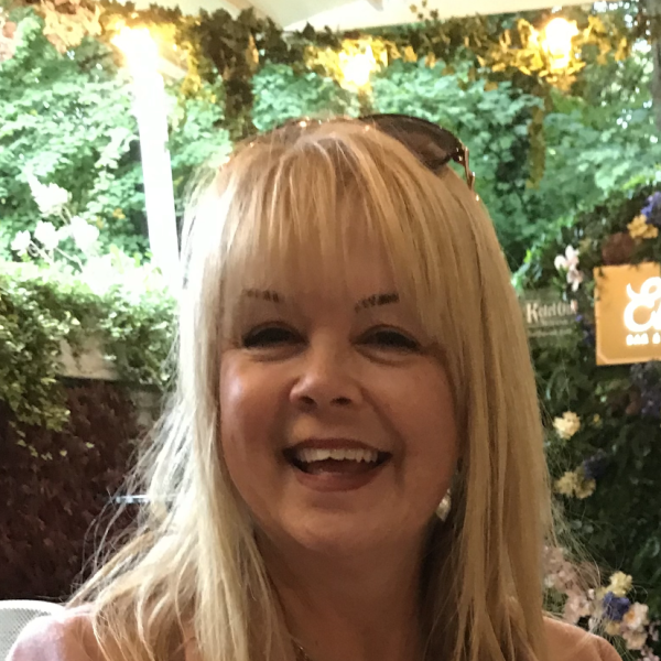 Sharon smiling at the camera