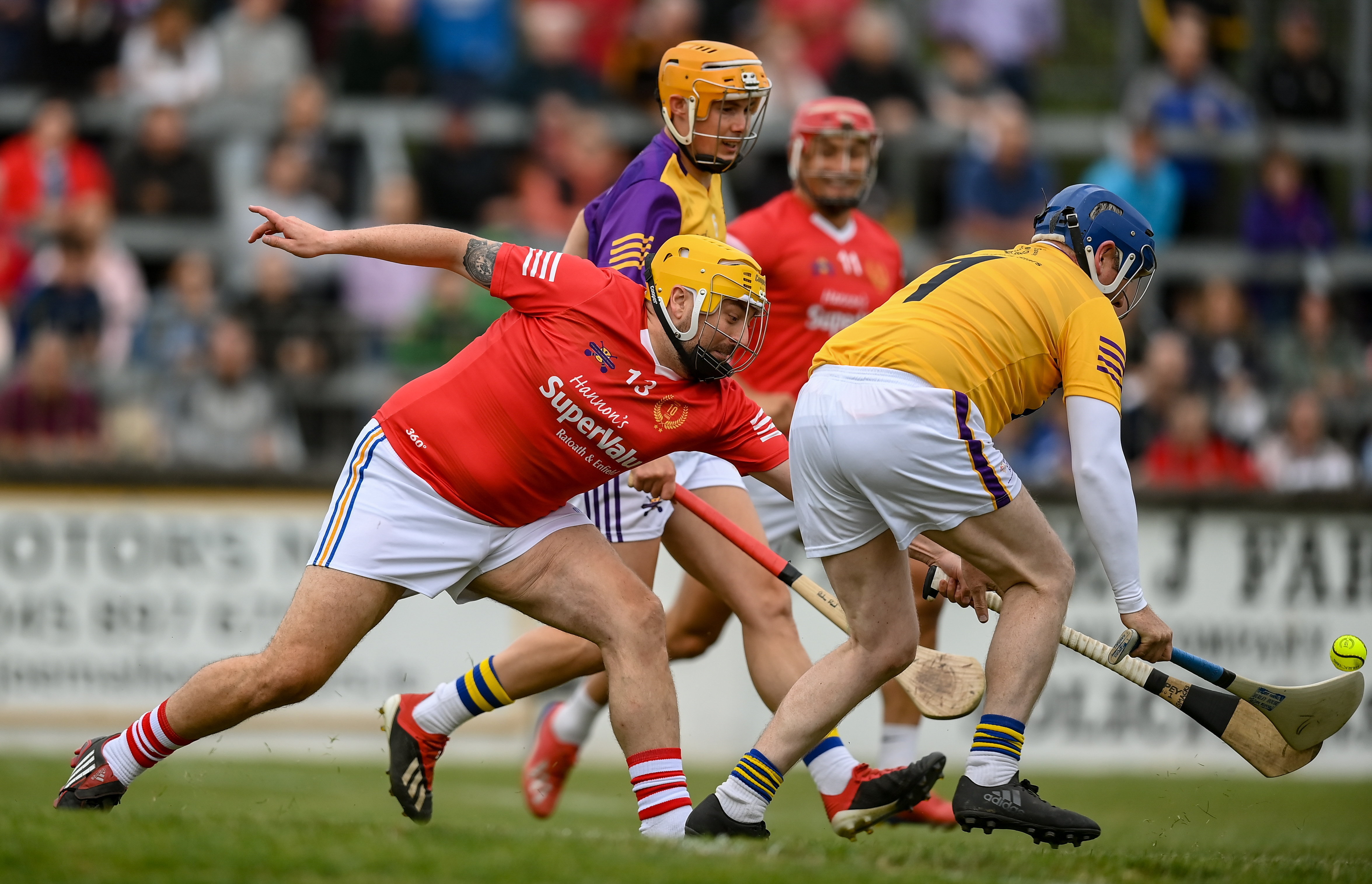 Hurlers playing at a Hurling for Cancer Research Match