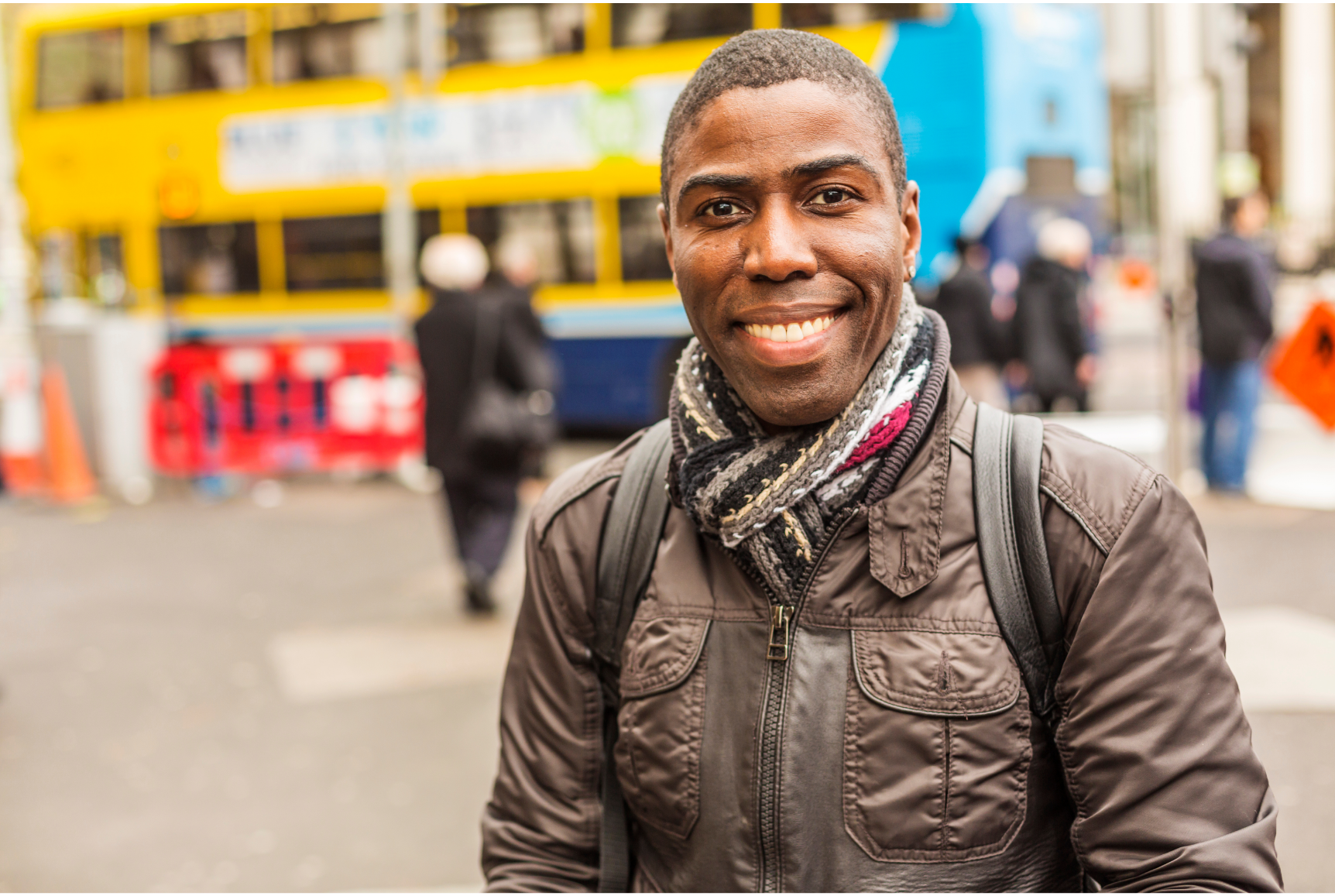Happy and stylish young Black man in Dublin street scene