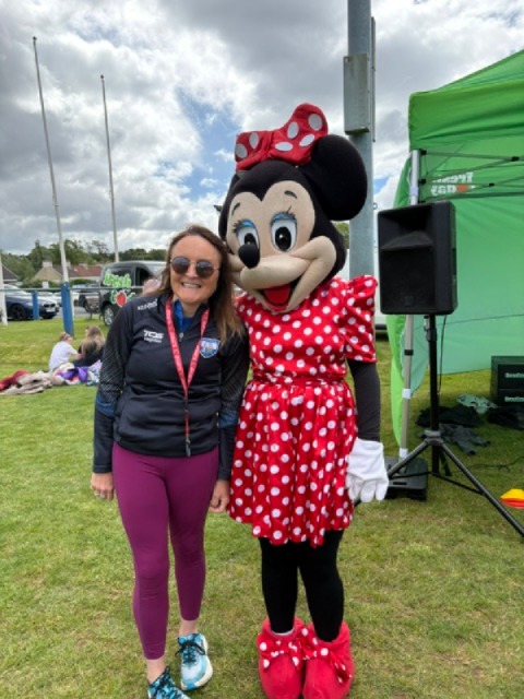Andrea with a Minnie Mouse mascot