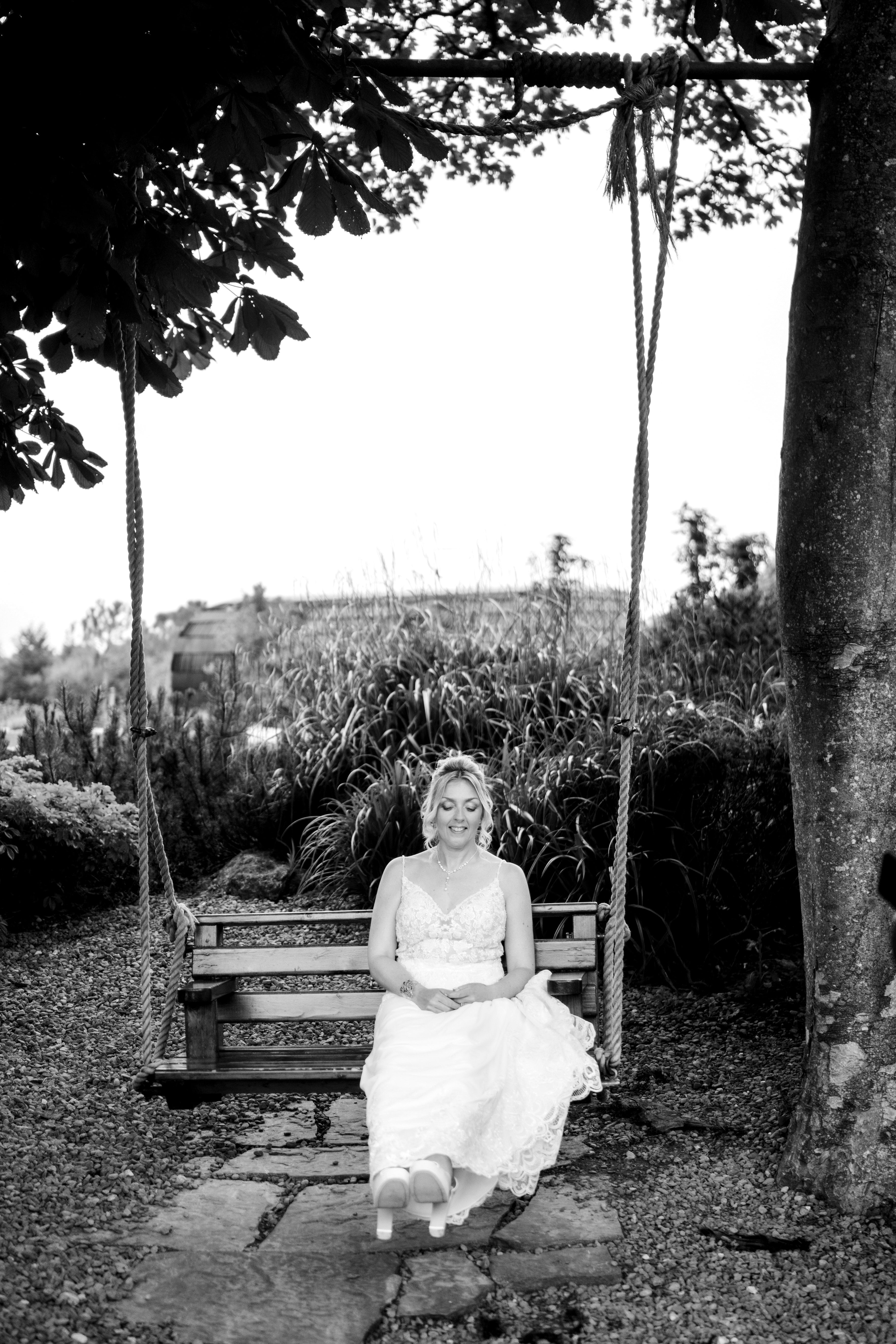 Hazel on a swing in black and white