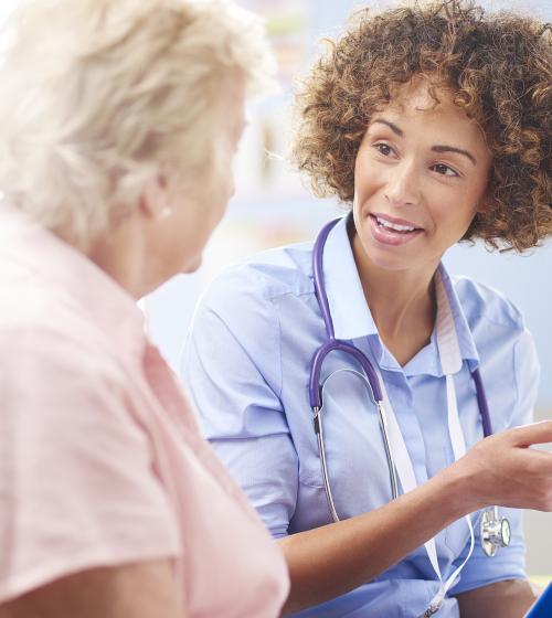 Woman talking to a nurse