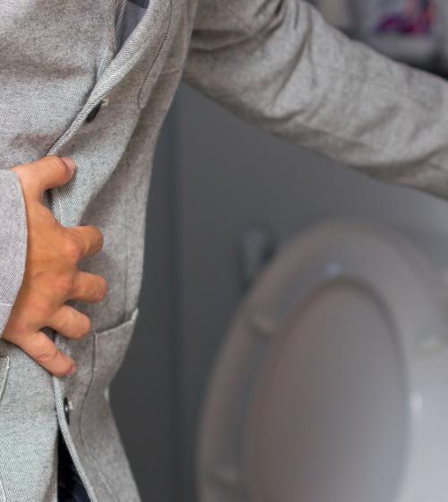 sick person in pain at toilet