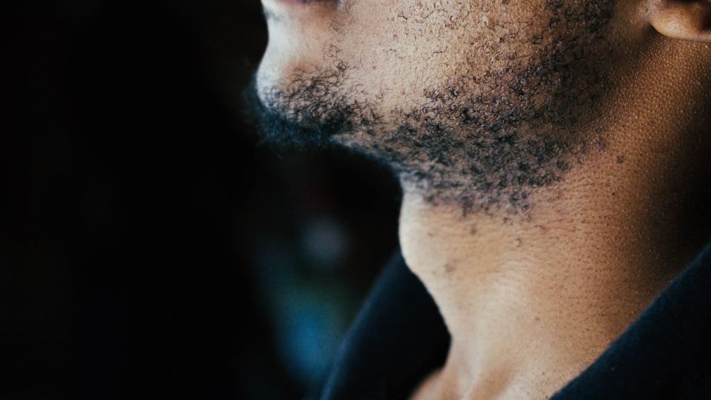 Man looking up with throat