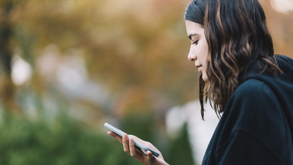 Teenager looking at phone