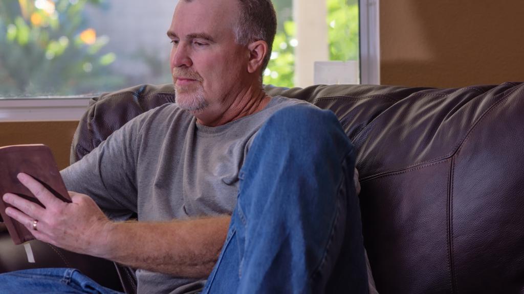 Middle aged man reading