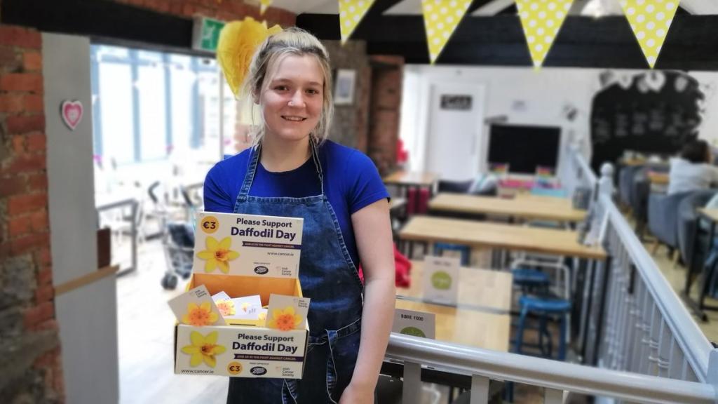 Woman at work selling daffodil pins
