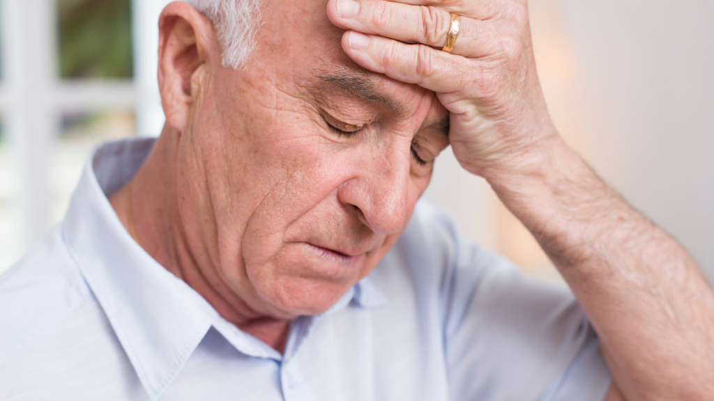 older man with headache