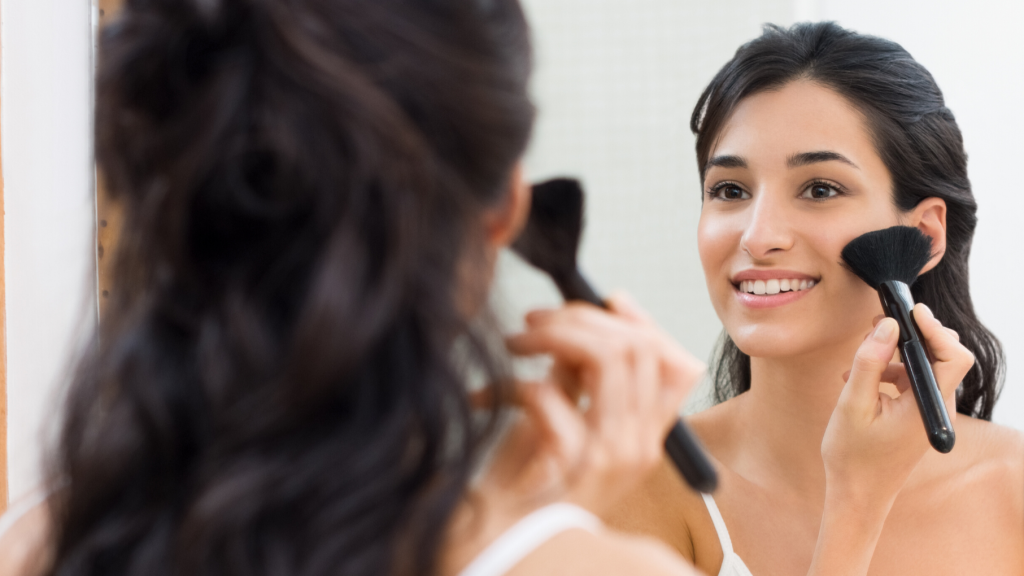 Woman applying make-up