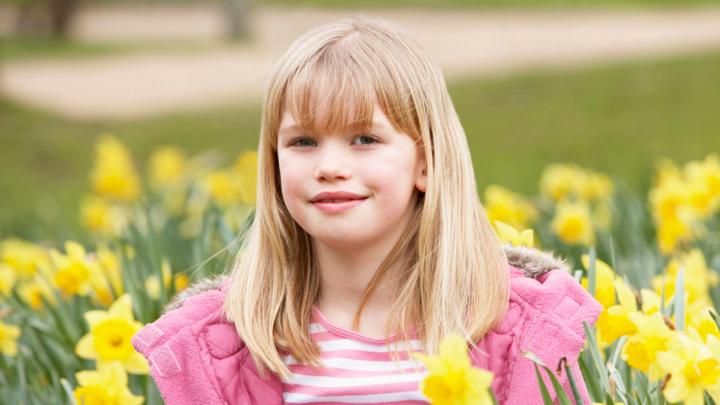 Girl surrounded by daffodils