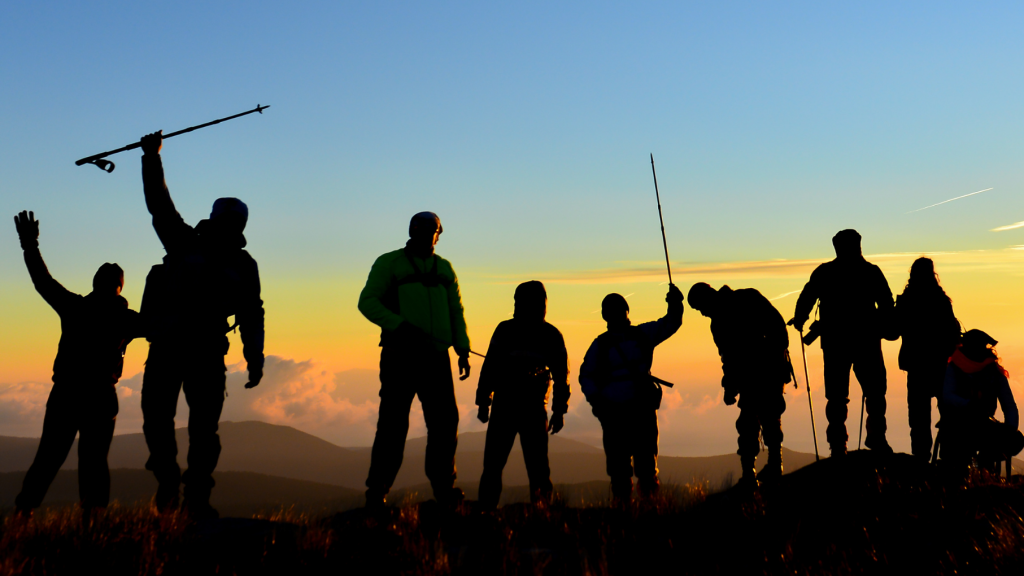 Group hiking at sunset