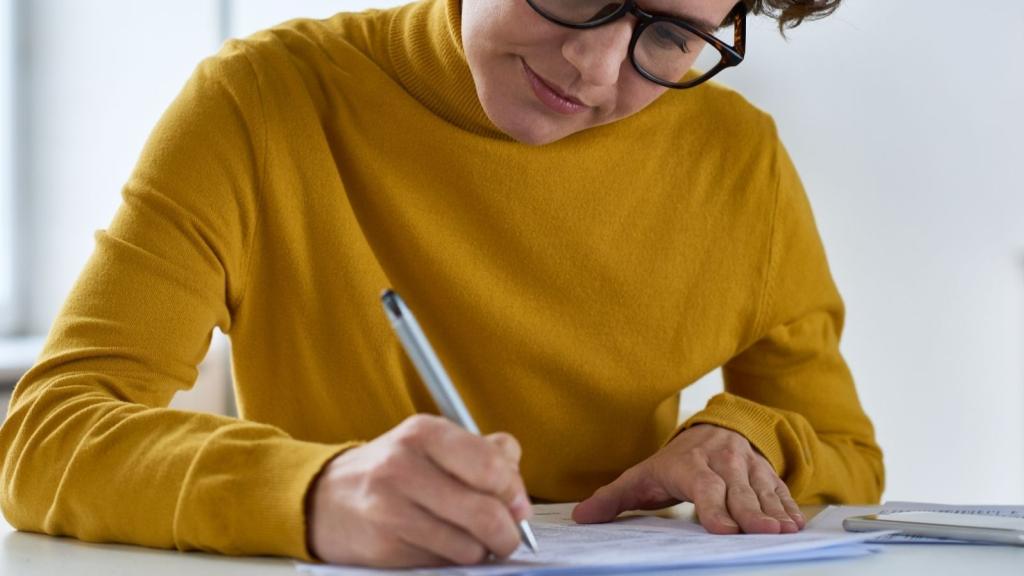 Person filling in a form / paperwork