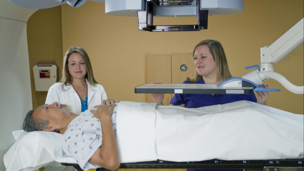 man going into a radiotherapy machine