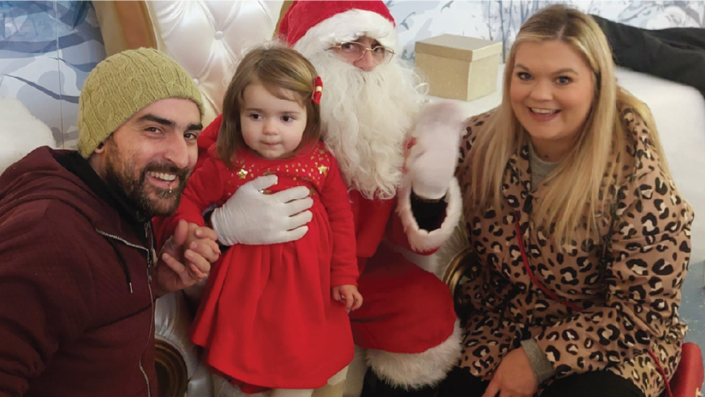 Jennifer Pearson with her husband Shane, and daughter Roxy smile at the camera