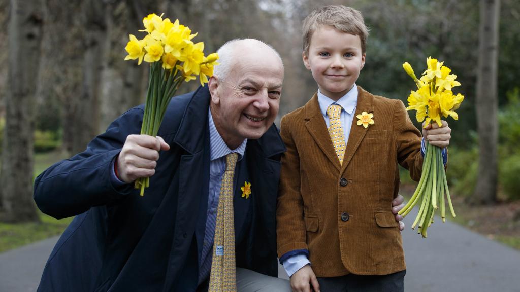 Bobby Kerr holding a bouquet of daffodils