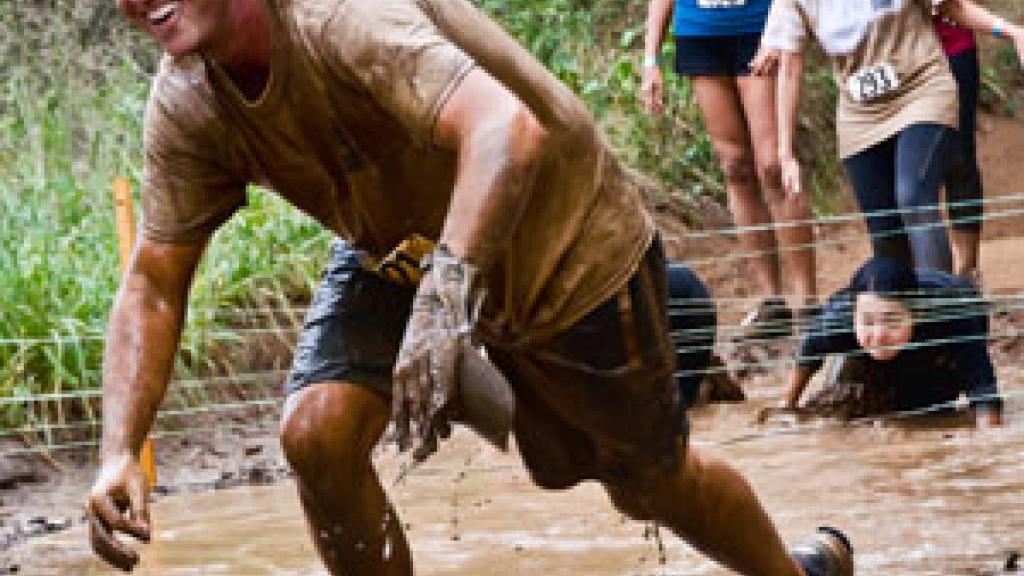 Irish Cancer Society supporters taking part in a mud run