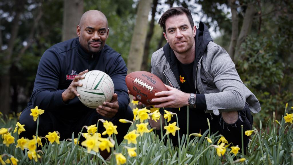 NFL player Chris Draft and Dublin GAA player Michael Darragh MacAuley in a daffodil garden
