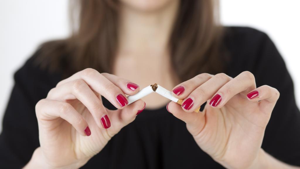 woman destroying cigarette