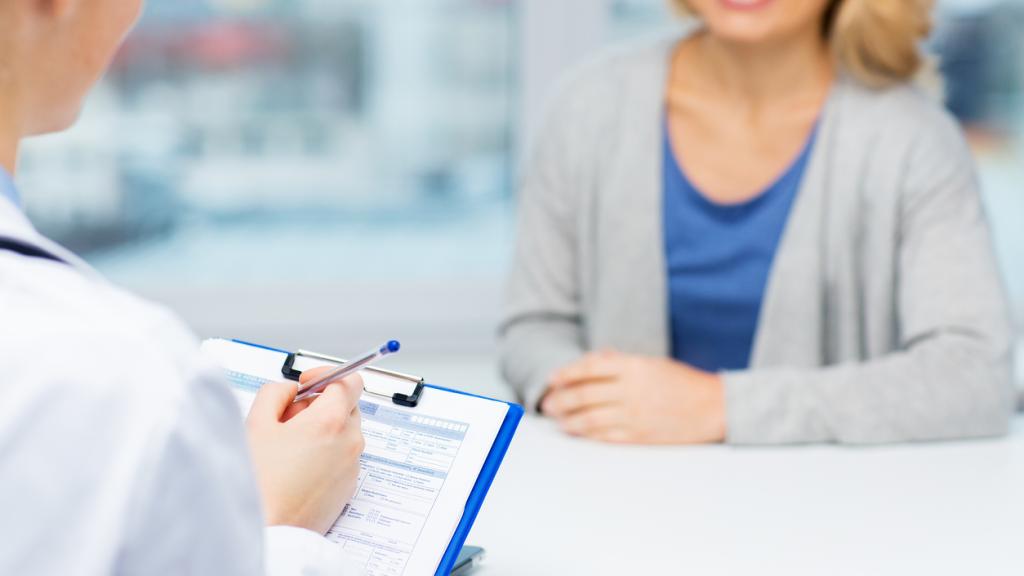 Woman waiting at clinic desk