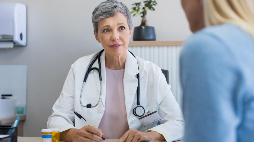 Doctor talking to female patient