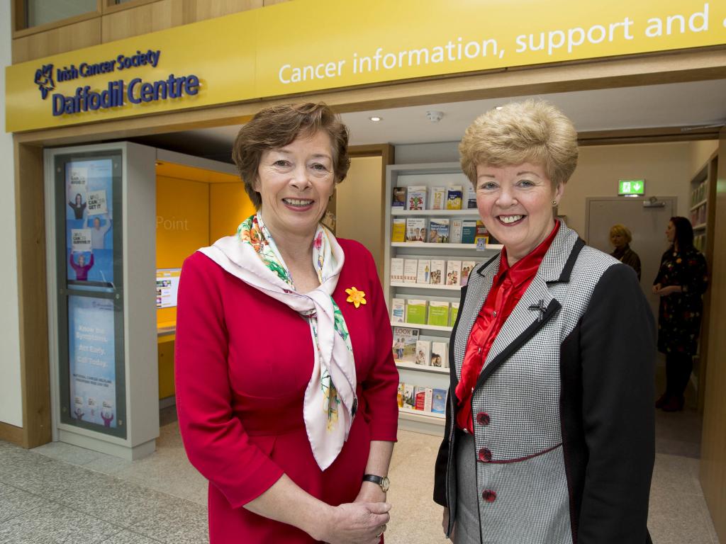 Cancer nurse and volunteer in front of a Daffodil Centre