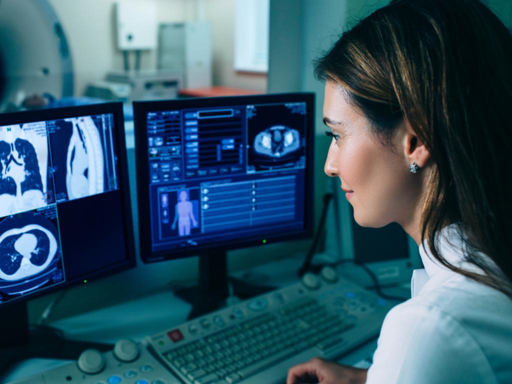 Doctor looking at x ray CT scan