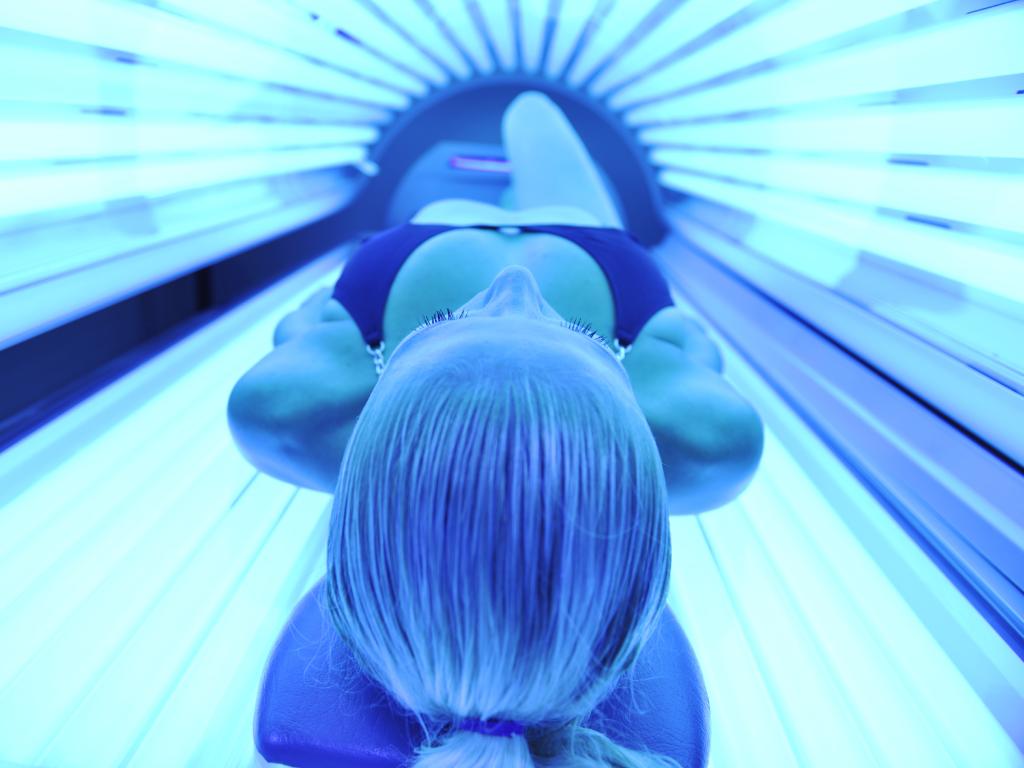 Woman in sunbed