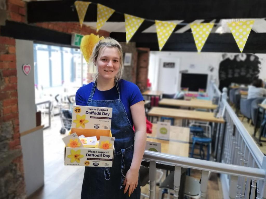 Woman at work selling daffodil pins