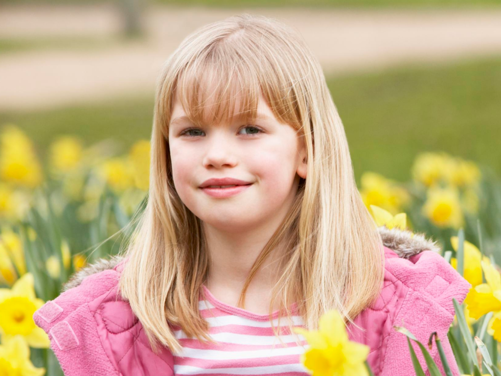 Girl surrounded by daffodils