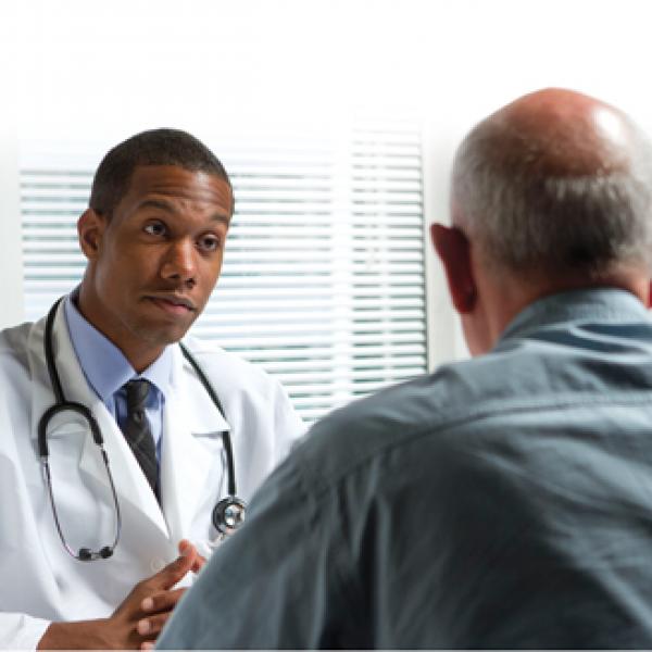 Doctor talking to a male patient
