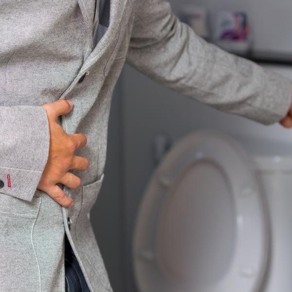 sick person in pain at toilet