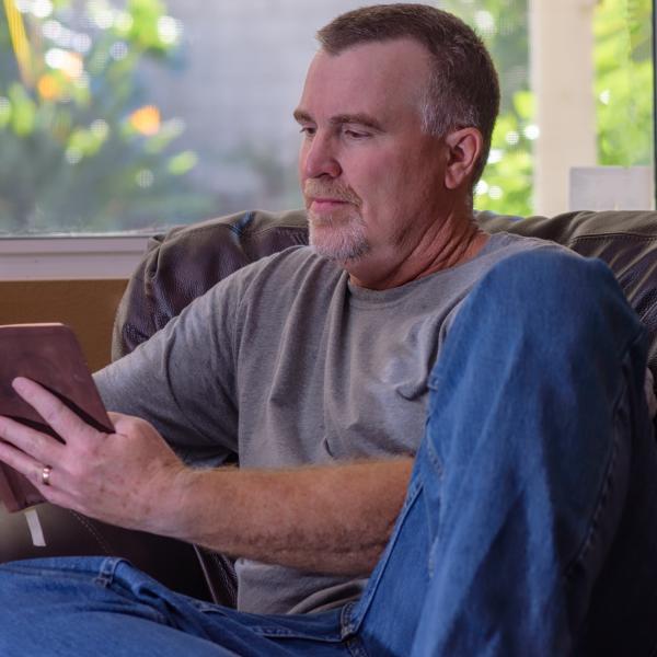 Middle aged man reading