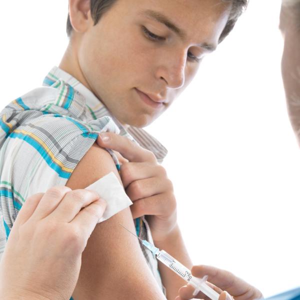 Teenage boy getting a needle