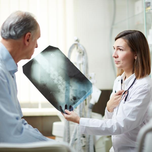 Doctor showing man an x-ray