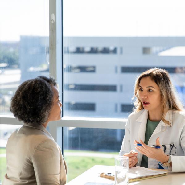 female doctor speaking to female patient