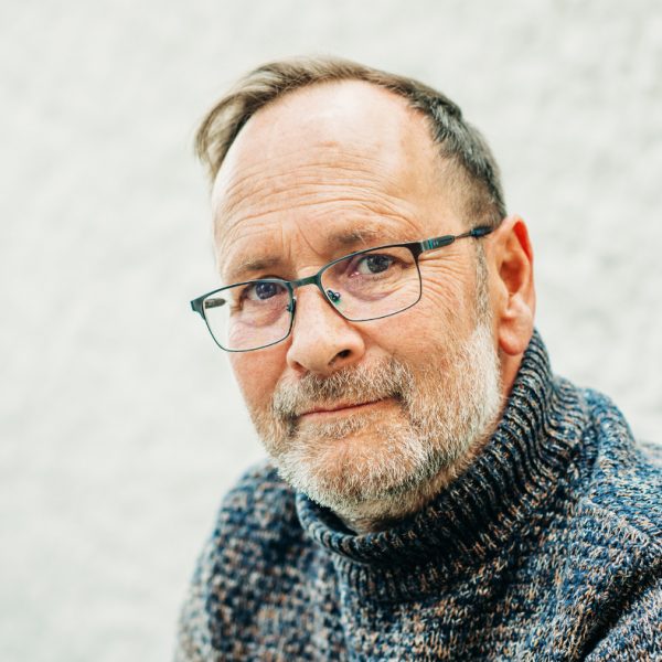 middle-aged white man with glasses and wooly jumper