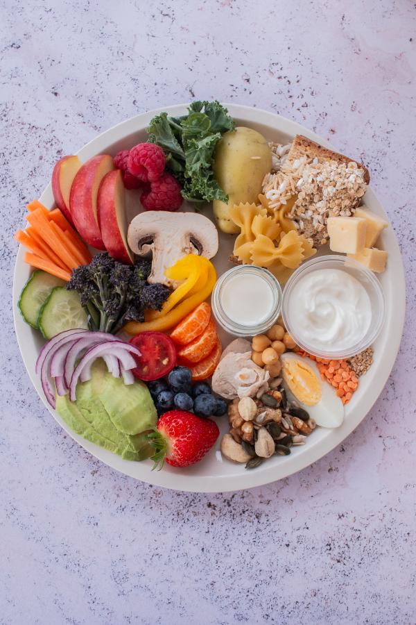 A balanced plate of healthy foods, including proteins, grains, fruits and vegetables