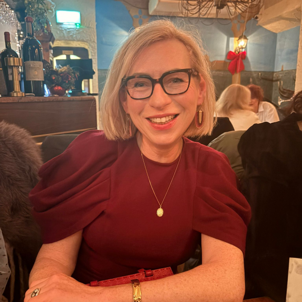 Fiona smiling in a restaurant