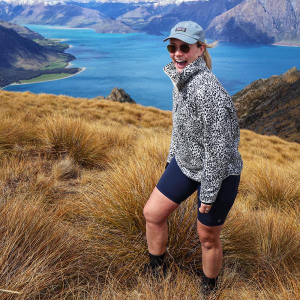 Roisin on a mountain overlooking a lake