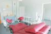 Gynaecological examination bed with stirrups for cervical smear test