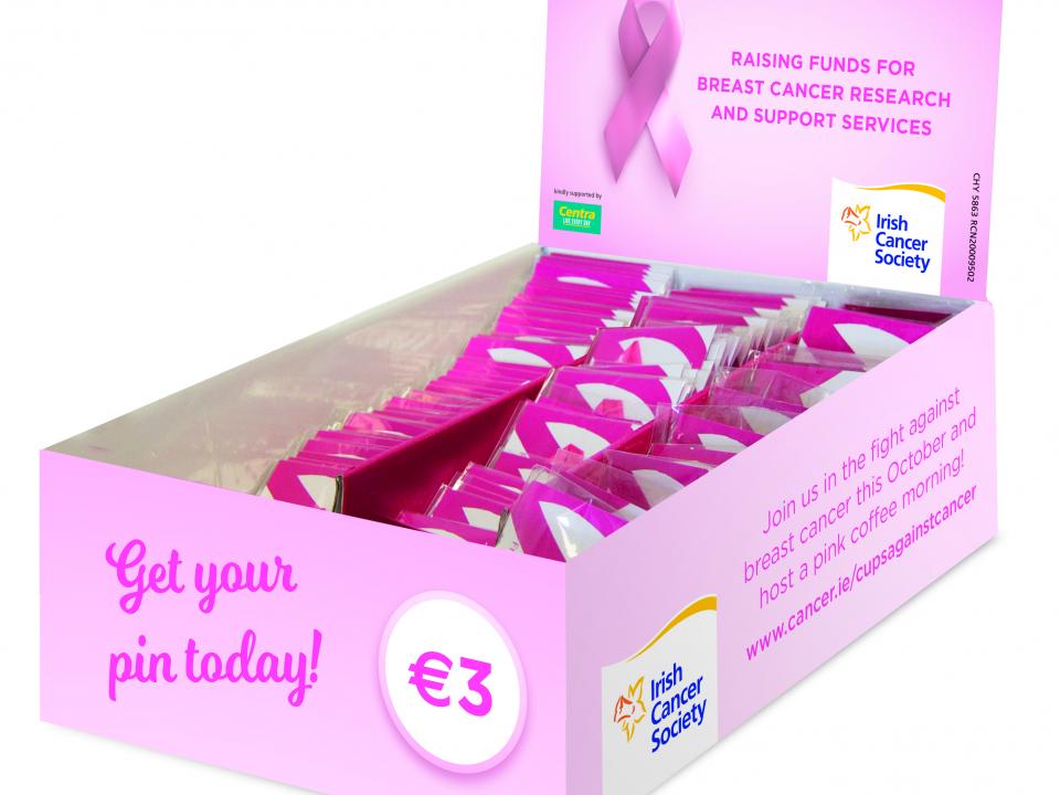Box of pink ribbon pins