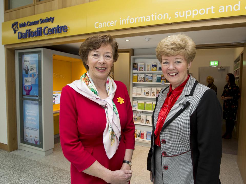 Cancer nurse and volunteer in front of a Daffodil Centre